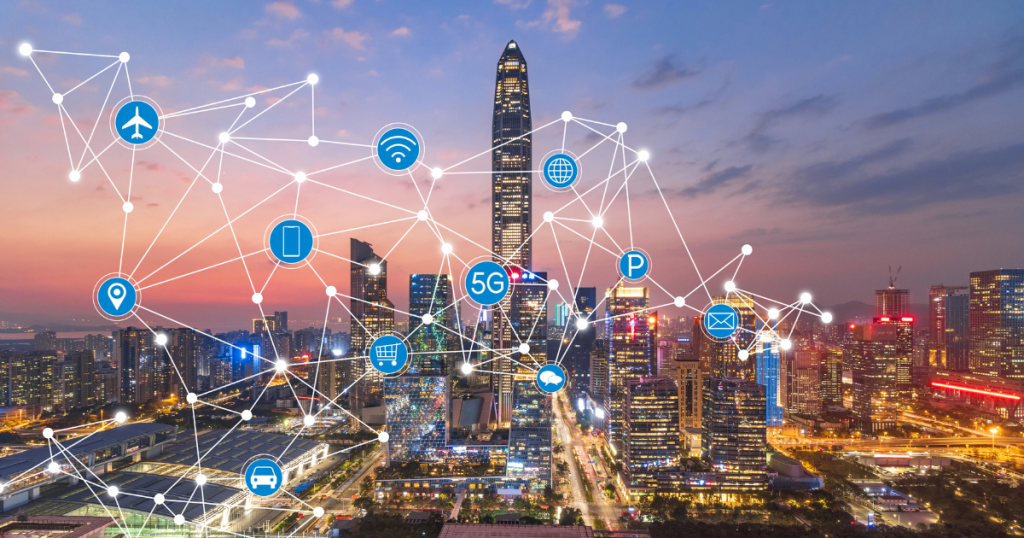 Smart city with 5G network and IoT technology integration across transportation, communication, and infrastructure at sunset.