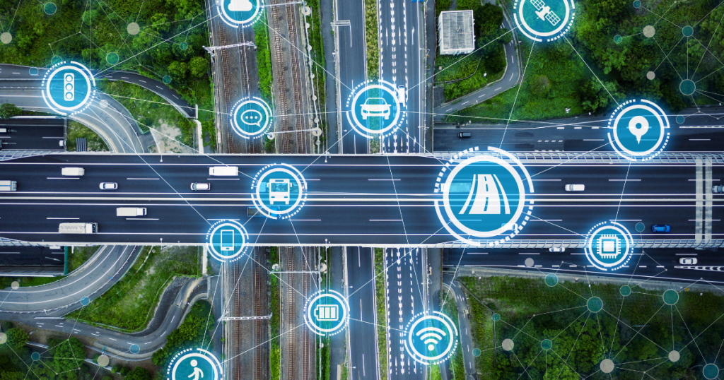 Aerial view of modern highway and railway network with smart transport icons, representing digital transformation and transport infrastructure development.